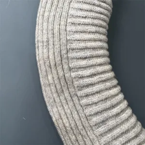 Close-up detail of women's merino wool ribbed knit socks, showing fine double-needle texture.