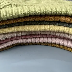 Merino wool knit socks detail shot, candy color ribbed texture, cozy multi-color sock pile.