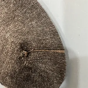 Close-up detail of merino wool blend knit socks, showing fine texture and seamless toe craftsmanship.