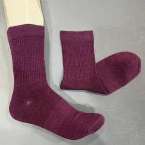 Detail view of purple merino wool blend mid tube ribbed socks, showcasing texture.