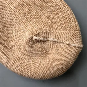 Merino wool sock detail, fine double-needle knit texture close-up, premium breathable fabric