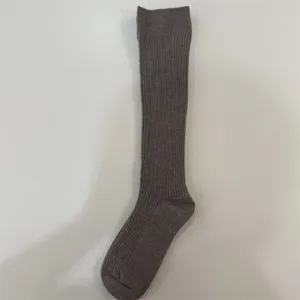 Merino wool knee high ribbed socks for women, solid color casual winter leg warmers.