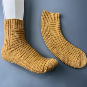Merino wool ribbed mid-tube sock detail showing soft knit texture and stretch cuff design.