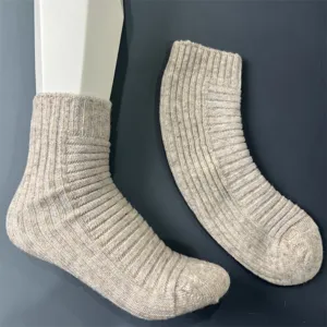 Detailed close up shot of women wool blend ribbed mid tube socks in light beige for daily wear.