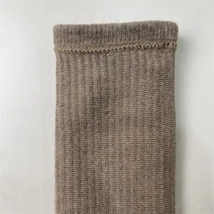 Close-up view of the ribbed cuff and knit texture of the thermal wool blend hiking sock.