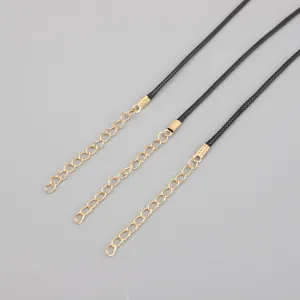 Detail of black wax cord necklace with gold extension chain and lobster clasp closure