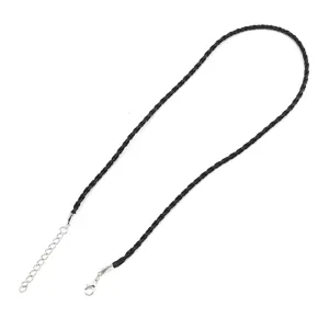 Detailed close-up of a black hand-woven braided cord necklace featuring a silver lobster clasp