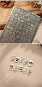 Detaillierte Ansicht der Nageltattoo-Stempelplatte TG-038 mit vielen süßen Motiven
