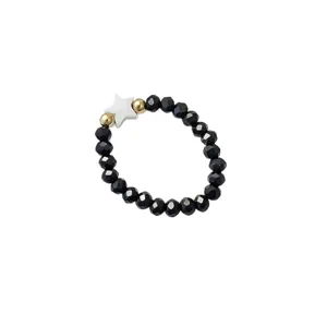Elegant Bohemian style elastic beaded ring featuring black glazed beads and shell star