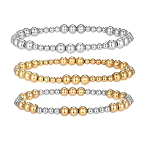 Dreiteiliges Set aus gold- und silberfarbenen Edelstahl-Perlenarmbändern mit elastischem Band