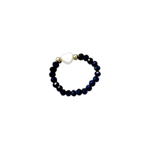 Elegant dark blue crystal beaded elastic ring with a white heart-shaped shell charm accent.