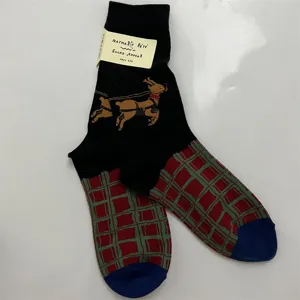 Women cotton mid-calf socks with cute reindeer motif, red green plaid pattern and tag.