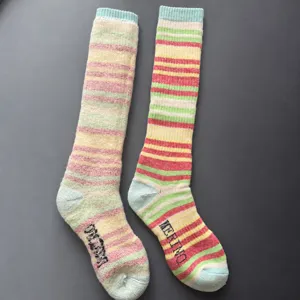 Merino wool ski socks detail, colorful striped thick thermal socks for outdoor sports.
