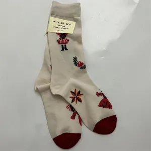 Women vintage cotton mid-tube socks with cute fairy tale character print and red heel.