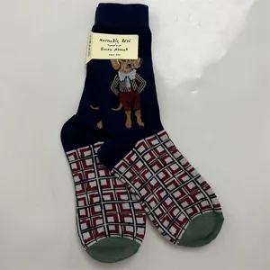 Close-up detail of women's mid-calf socks with cute dog illustration and grid pattern.