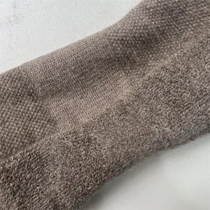 Detailed view of the 80% merino wool thickened half-terry outdoor sports socks fabric.