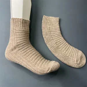 Detail shot of women's merino wool ribbed mid tube socks in beige, comfortable daily knitwear.