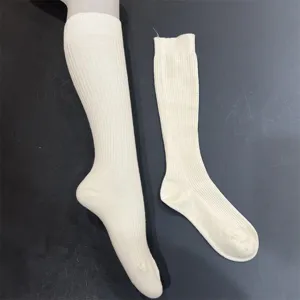 Calze lunghe a costine in tinta unita da donna, comode e morbide per uso quotidiano.