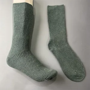 Green ribbed knit merino wool blend socks detail view, comfortable mid-calf winter outdoor wear.