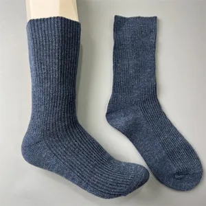Close-up of dark blue ribbed merino wool knit socks, showing fine texture and daily comfort.