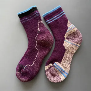 Thick merino wool winter socks detail, heavy cushioned thermal loop design for cold outdoor sports.