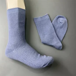 Merino wool knit mid-calf socks detail showing ribbed cuff and soft texture close up.