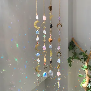 Detail view of hanging natural crystal sun catchers creating rainbow light on wall