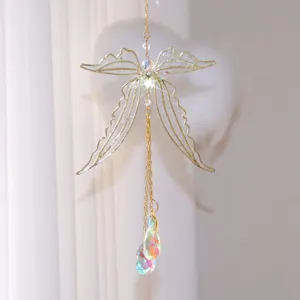 Close-up detail of dragonfly wings suncatcher with sparkling iridescent crystal drops