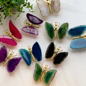 Detail view of various colorful natural agate slice butterfly ornaments for home desktop decoration