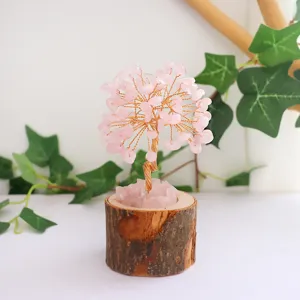 Natural rose quartz life tree ornament with rustic wooden log base for home decor