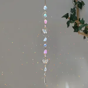 Detailed view of a garden sun catcher with natural pink crystals and butterfly prisms