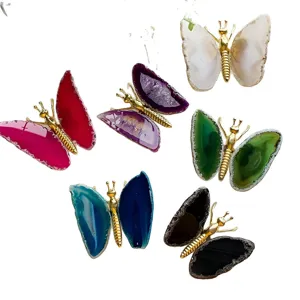 Set of handmade butterfly ornaments made from natural colorful agate slices and gold metal.