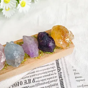 Raw natural crystal stones on a wooden base for cozy bedroom atmosphere lighting