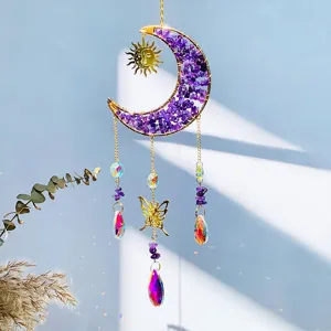 Detailed view of moon suncatcher with amethyst chips and crystal prism reflections.