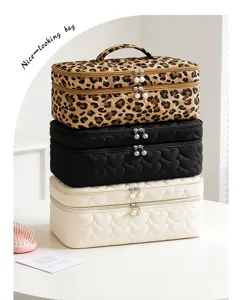 Stack of quilted heart and leopard print large capacity makeup organizer bags