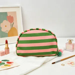 Modern dopamine style striped shell-shaped makeup bag with pink and green horizontal patterns