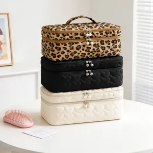 Collection of large capacity makeup bags in leopard print and heart quilted styles