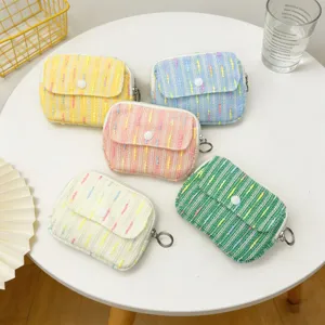 Pastel tweed mini storage bags for coins and lipstick, vibrant multi-color assortment.