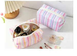 Large striped seersucker cosmetic bag for travel and skincare storage