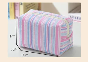 Detailed view of the striped seersucker makeup bag showing dimensions of 16x9x9cm