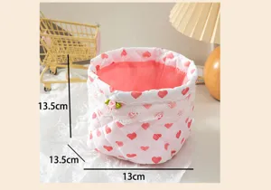 Detailed dimensions of pink quilted heart storage basket with lace trim decoration.