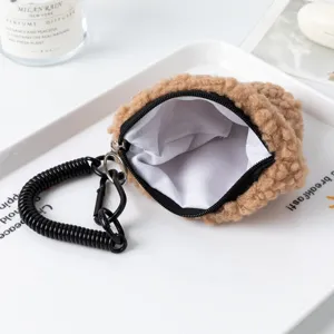 Plush rice ball shaped coin purse with black zipper and coil spring keychain hook
