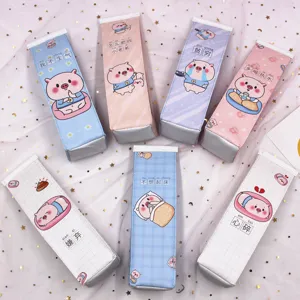 Detail view showing seven variants of creative milk carton pencil cases with pig motifs