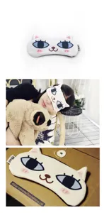 Detailed view of a cute cartoon cat sleeping mask with soft blackout fabric for sleep