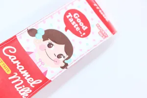 Detailed close-up showing the leather texture of a cute cartoon milk box pencil case