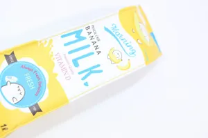 Detail view of cute banana milk carton pencil case with leather texture