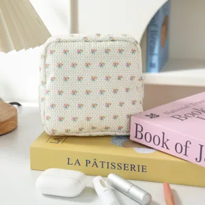 Borsa in corduroy con fiori per assorbenti, astuccio portatrucchi portatile carino.