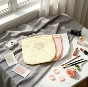 Pastel ribbed fabric makeup bags with delicate heart-shaped lace bow embroidery