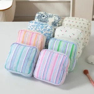Collection of seersucker and corduroy storage bags in various striped and floral patterns