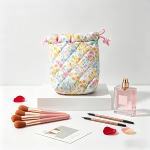 A detailed view of the quilted floral makeup pouch displayed with elegant beauty props